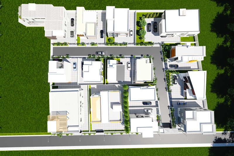 Bridge City Estate from directly above: houses either side of an internal street, planted strips between the plots, parking bays along the frontages and a public road along the bottom edge.