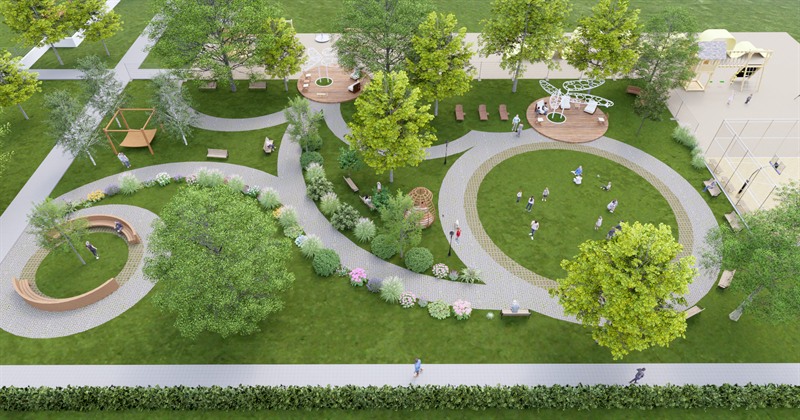 The Sensory Garden seen from above: looping paths through lawn, curved timber benches, planting beds, timber pods and a play structure along the far edge.