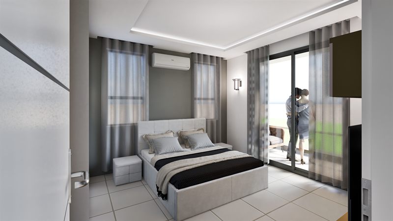 A bedroom: a double bed with an upholstered headboard and two ottomans at its foot, curtains across two windows, a split air conditioner above, and a sliding door to a balcony at the right.