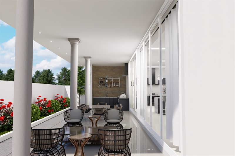 The back porch: round columns down the open left side carrying the roof, full-height sliding glazed doors along the right into the dining area with a stone-clad wall beyond, woven chairs around small round tables on a polished floor, and a low white wall with roses and lawn past it.