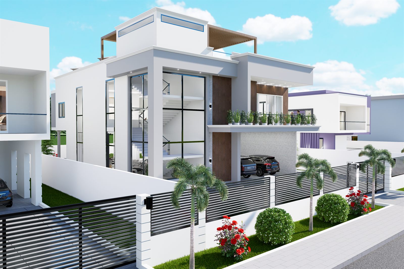 The house from the approach: the glazed stair bay running the full height, the roof-level volume with a timber-faced canopy above it, planting in troughs along the first-floor edge, a car under the carport, and the boundary wall and slatted fence running along the pavement behind palms and clipped shrubs.